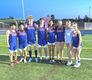 Pictured left to right are 4×400 teams: Julian Martinez, Lee-Allen Esperza, Kaleb Spears, Andrew Key, Breanna Iverson, Chloe VanVranken, Ella VanVranken, and Zoey Snider.