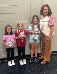 Smithville Elementary School-Wide Spelling Bee Winners: Kindergarten: Dalilah Velasquez, 1st grade: Ashlyn Fox, and 2nd grade: Laylah Hale pictured with SES Principal Anita Puckett