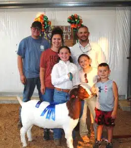 Andrea Kate Estes of Smithville was a big winner in the Junior Goat Show at the DeKalb County Fair Thursday evening. Estes won for Junior Showmanship and the Doe Kid Division as well as the Overall Doe Kid and Yearling Doe Grand Championship. Andrea is pictured here with her family and winning Doe Kid entry: (Left to right) Carl Paris, Emily Estes, Andrea Estes, Andy Estes, Caroline Estes and Sterling Estes