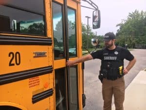 Law enforcement officers even checked school buses parked at both Northside Elementary and Smithville Elementary School during a lock-down intruder drill Monday. Pictured Deputy Steven Lawrence of the DeKalb County Sheriff's Department