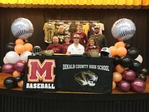 DCHS baseball senior Ty Webb signed with Maryville College at DCHS. Pictured here left to right seated: DCHS Baseball Coach and Ty’s father Tad Webb, brother Tate, Ty Webb, and mother Tracy Webb. Standing left to right: Assistant Coach David Parker, brother Tucker Webb, and Assistant Coach Daniel Leslie