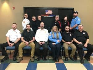 B&B Emergency Equipment sponsored 75% DeKalb Fire Department training awards which were or will be presented to 16 DeKalb County Firefighters (some were absent from the banquet Saturday night to receive their award) Pictured left to right sitting: Justin Bass (B&B Emergency Equipment), Austin Ostrander, Anthony Boyd (B&B Emergency Equipment), Christina Hovey, Station Commander Keith Elkins, Steve Repasy. Standing left to right: Dustin Johnson, Jordan Lader, Triston Brandon, Shawn Puckett, Heather Lader, Station Commander Blake Reffue