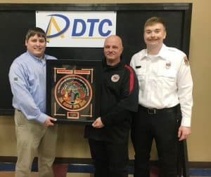 DeKalb Firefighter Terry Phillips of the Four Seasons Station was named the recipient of the 2024 DeKalb Telephone Cooperative (DTC) Rookie of the Year Award presented by Justin Mauldin of DTC and DCFD training officer Luke Green.