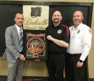 DeKalb Fire Fighter Alex Woodward of the Cookeville Station was honored Saturday night with the DeKalb Funeral Chapel “Git R Done” Award presented by Shannon Estes of DeKalb Funeral Chapel and Captain Brian Williams.