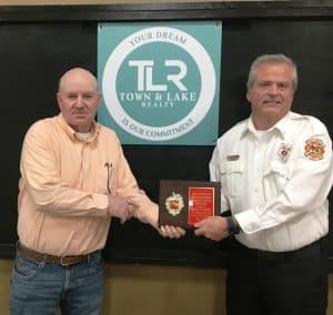 The 2024 Town and Lake Realty Honorary Lifetime DeKalb Fire Department Membership honoree is Captain Blake Cantrell. Jeff Williams, a previous honorary lifetime member presented the award
