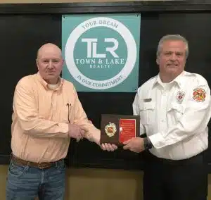 The 2024 Town and Lake Realty Honorary Lifetime DeKalb Fire Department Membership honoree is Captain Blake Cantrell. Jeff Williams, a previous honorary lifetime member presented the award