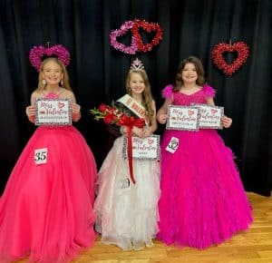 10-year-old MaKenna Grace Billings of Sparta (center) claimed the crown Saturday in the Valentine Pageant category for 10-12 year old girls. Runners-up were 1st- Katy Jo Bowen of Liberty (right). Second runner-up was Katie Jo Prichard of Alexandria (left