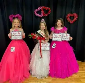 10-year-old MaKenna Grace Billings of Sparta (center) claimed the crown Saturday in the Valentine Pageant category for 10-12 year old girls. Runners-up were 1st- Katy Jo Bowen of Liberty (right). Second runner-up was Katie Jo Prichard of Alexandria (left