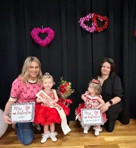 Indy Hart Williams of Smithville (left) was crowned queen of the 13–24-month age group in the Valentine Pageant Saturday. She is the 23-month-old daughter of Brian and Stephanie Williams. She was also awarded for prettiest smile. First runner-up was Katlyn Gibbs of Sparta (right) 14-month-old daughter of Jana Gibbs. She was awarded for prettiest eyes, hair, attire and most photogenic.