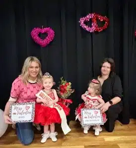 Indy Hart Williams of Smithville (left) was crowned queen of the 13–24-month age group in the Valentine Pageant Saturday. She is the 23-month-old daughter of Brian and Stephanie Williams. She was also awarded for prettiest smile. First runner-up was Katlyn Gibbs of Sparta (right) 14-month-old daughter of Jana Gibbs. She was awarded for prettiest eyes, hair, attire and most photogenic.