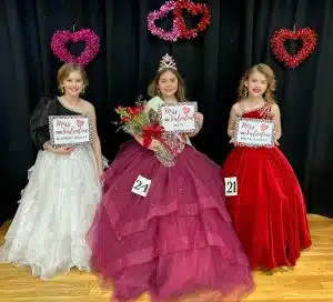 Capturing the Valentine Pageant crown in the 7–9-year-old division Saturday was Aleeya Weslyn Graham of Smithville (center).Runners-up were 1st- Rozlyn Marie Prichard of Smithville (right). Second runner-up Novalee Carol Billings of Sparta (left)