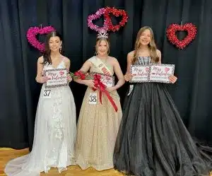 Baylei Anne Benson of Smithville (center) won the crown Saturday in the 13–15-year-old Valentine Pageant category. She was awarded honors for prettiest eyes and attire. Runners-up were 1st-Kenzi MaKaya Barnes of Smithville (left). She was named most photogenic. Second runner-up went to Charley Loren Prichard of Liberty (right). She was also judged to have the prettiest hair and smile.