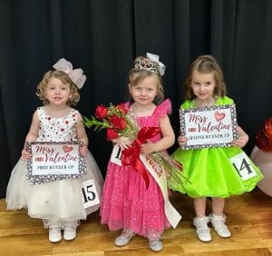 The winner of the Valentine Pageant Saturday (age 25- 48-month category) was Queen Olivia Grace Jones of Smithville (center). Runners-up were 1st- Elsie Pearl Paschal of Alexandria (left). Second runner-up was Evie Kate Billings of Sparta (right)