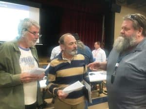 Mike Antoniak (left) and Steven Cantrell (center) speak with County Commissioner Myron Rhody after TDEC hearing on SRM Quarry NPDES permit application Thursday night at county complex.