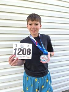 8th Grader Kaden Mullinax Competes in Half Marathon