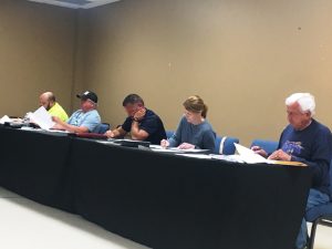 Members of county commission left to right: Greg Matthews, Glynn Merriman, Brandon Donnell, Sabrina Farler, and Larry Green. Commissioners Daniel Cripps and Tom Chandler absent