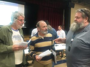 Mike Antoniak (left) and Steven Cantrell (center) speak with County Commissioner Myron Rhody after TDEC hearing on SRM Quarry NPDES permit application Thursday night at county complex.