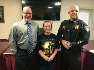Alexandria Mayor Beth Tripp congratulates Interim Police Chief Vincent Turocy (right) after his being named full time chief by a majority of the aldermen Monday night, April 7. Also by a majority vote, the aldermen hired Nathaniel (Nate) Lombard (left) as a full time officer
