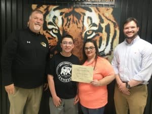 DCHS Freshman Christopher Gallegos writes winning “Parents of the Month” essay for his mom and dad Tiffany and Abel Cota. Pictured left to right: DCHS Principal Bruce Curtis, Christopher Gallegos and his mother Tiffany Cota, and Assistant Principal Seth Willoughby
