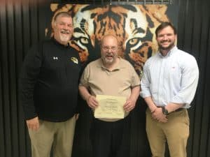 The March Teacher of the Month award at DeKalb County High School goes to Kevin Burchfield. Pictured left to right: DCHS Principal Bruce Curtis, Kevin Burchfield, and Assistant Principal Seth Willoughby