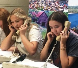 DCHS Seniors Caroline Crook and Madeline Martin answering phones taking pledges during the WJLE DCHS Class of 2025 Project Graduation Radiothon on Friday, April 18. A record breaking $13, 685 was raised during the three-hour program