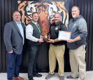 Dylan Kleparek (Coach K), science/chemistry teacher, the 2025 School Level Teacher of the Year at DeKalb County High School. Pictured left to right: Supervisor of Instruction Randy Jennings, Director of Schools Patrick Cripps, DCHS Teacher of the Year Dylan Kleparek, and DCHS Principal Bruce Curtis