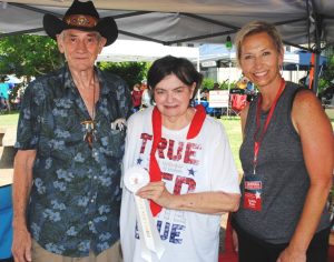 Fiddlers Jamboree Crafts Director Judith Hale presents “Best Newcomer Craft” Award to David and Bonnie McCallie of Nashville. They displayed handcrafted music boxes and leather products including key fobs