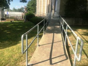 Handicapped ramp on the east side of the courthouse leads to the only secured entrance to the building All other entrance doors are locked from the outside