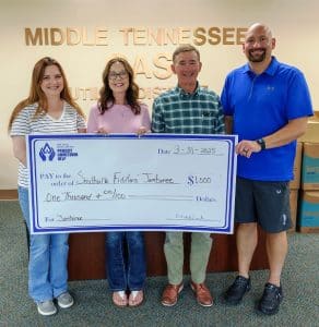 MTNG Makes Donation to Fiddlers' Jamboree: From left to right: Wendy White, Debbie Staley, Mike Corley from Middle Tennessee Natural Gas, and Alex Woodward, Marketing Director of Smithville Fiddlers’ Jamboree . Photo by Bill Luton