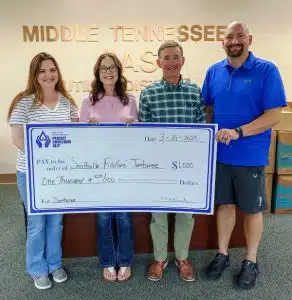 MTNG Makes Donation to Fiddlers' Jamboree: From left to right: Wendy White, Debbie Staley, Mike Corley from Middle Tennessee Natural Gas, and Alex Woodward, Marketing Director of Smithville Fiddlers’ Jamboree . Photo by Bill Luton