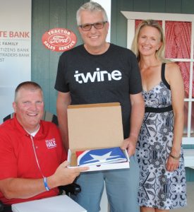 State Representative Michael Hale presented a Tennessee State flag Friday to Justin and Jennifer Woody of Everett Washington who traveled the longest distance from across the nation to get here for the Fiddlers Jamboree