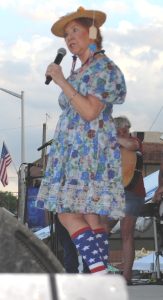 Alice Comber portrays Minnie Pearl during Opry tribute by Community Chorus Friday at Jamboree