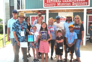 Ella Derby won the Beginner Fiddling Title and the coveted James G. “Bobo” Driver Memorial Award Saturday. Members of Mr. Driver’s family presented the award to Derby.